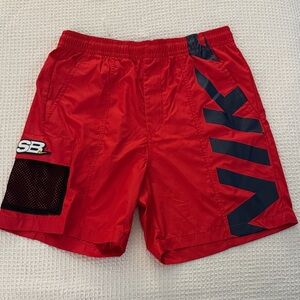 Nike Men's Red Athletic Shorts with Black Accents